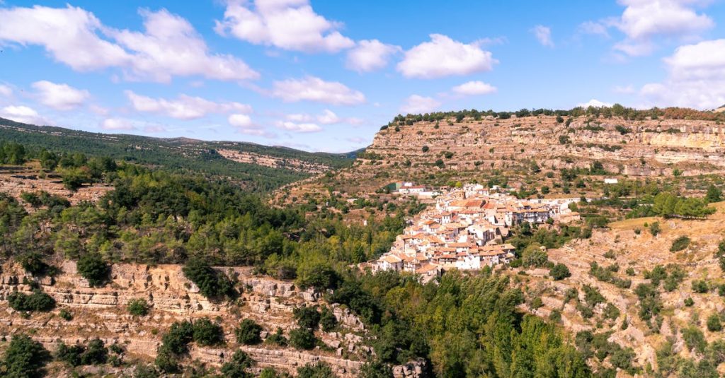 Scenic view of a quaint village nestled within the mountains of Castellón, Spain.